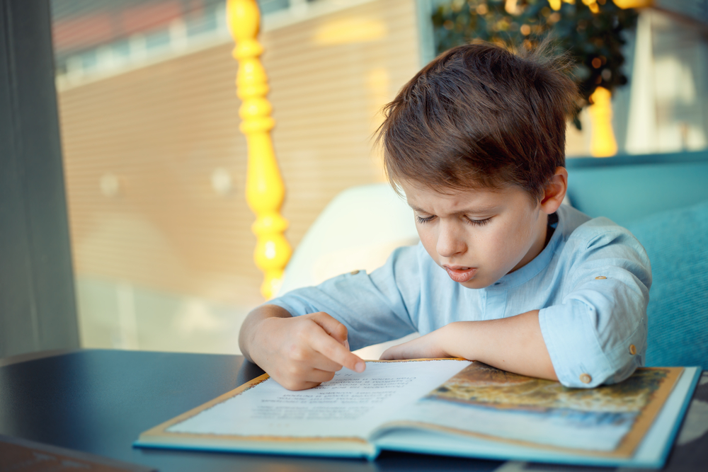 Boy frustrated reading