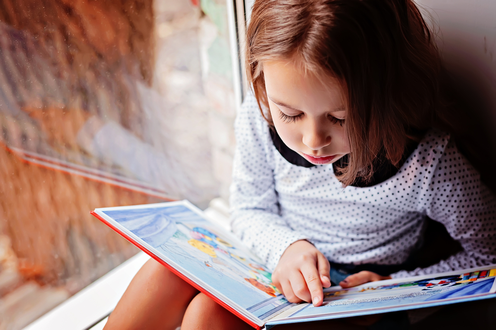 A young reader practicing to read