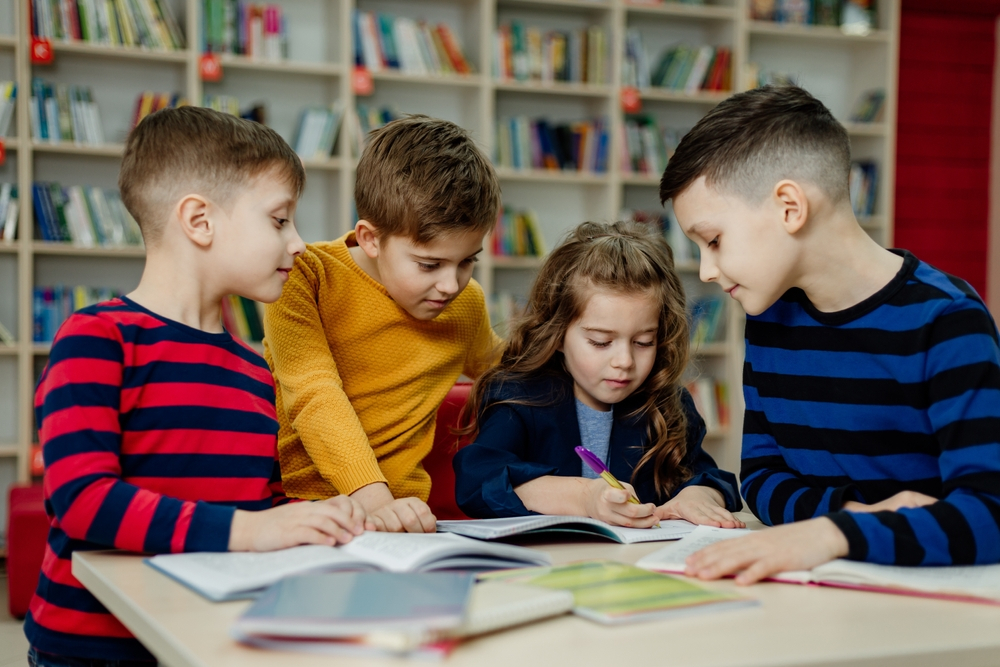 A confident child enjoying independent reading thanks to a reading intervention program.