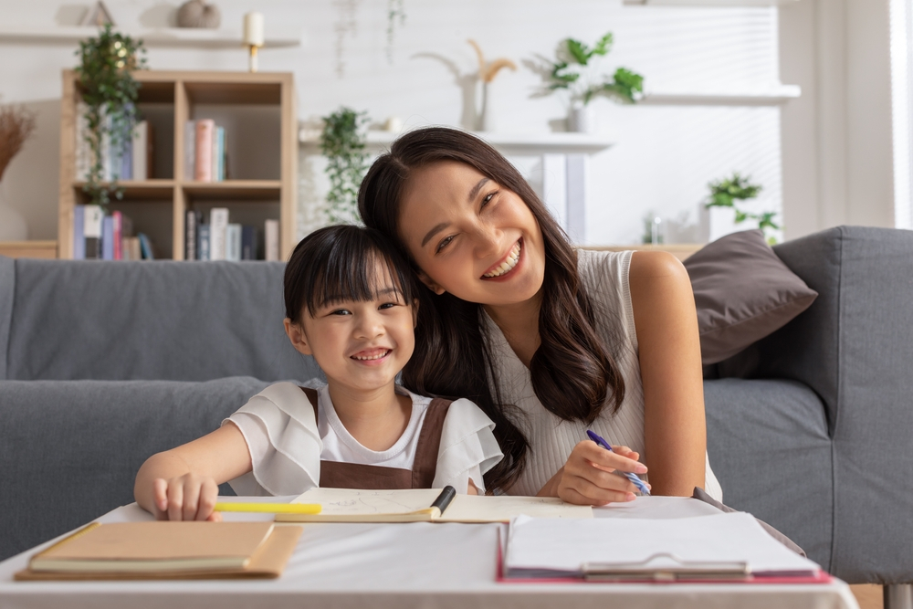 A child and adult engaging in a reading activity together, exemplifying strategies to assist children struggling to read.