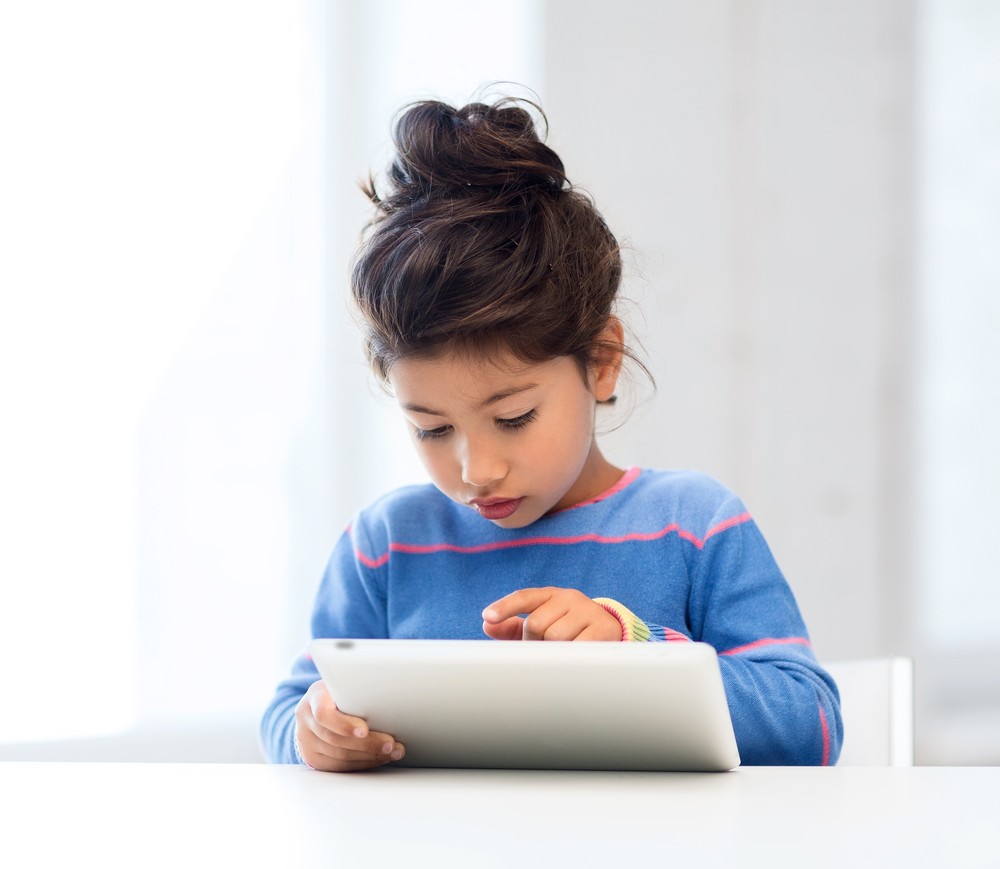 Child using tablet for reading comprehension strategies