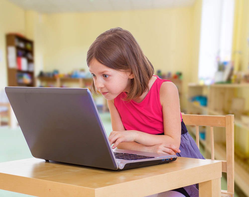 Child enjoying an interactive reading app for educational development