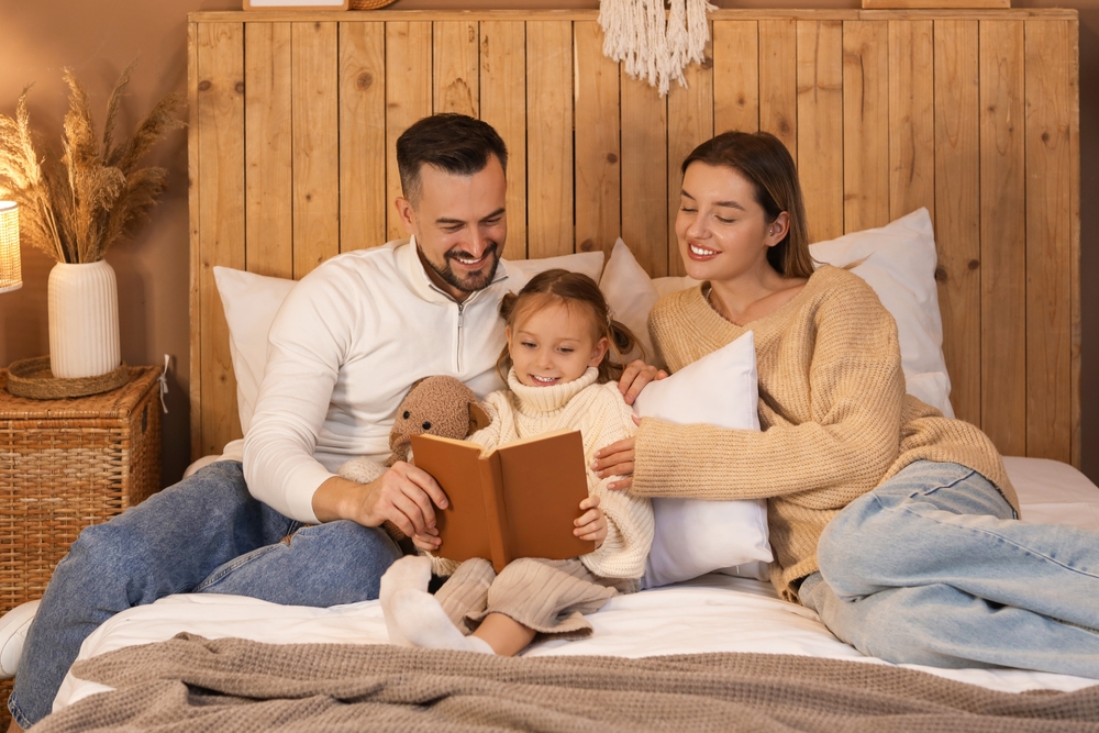 Family sharing a winter books read aloud session at home