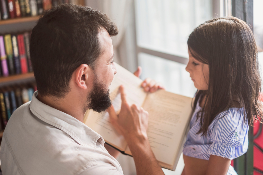 Man engaging in critical thinking reading activity with a child