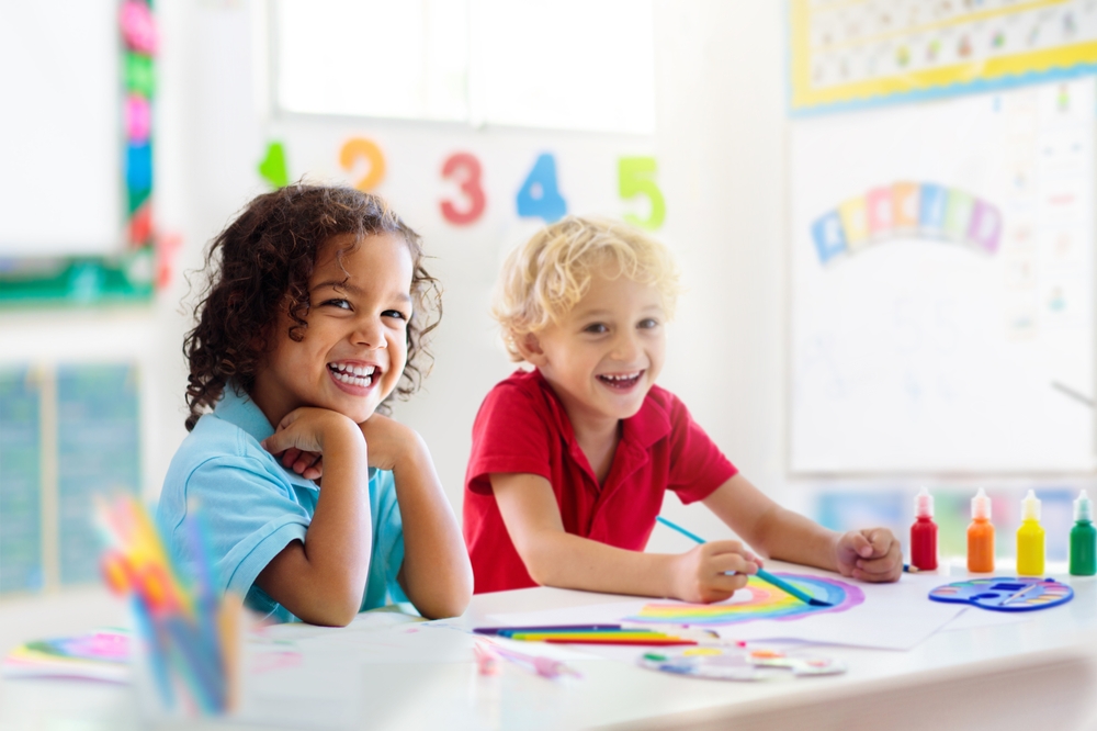 Children learning how to read through creative classroom techniques