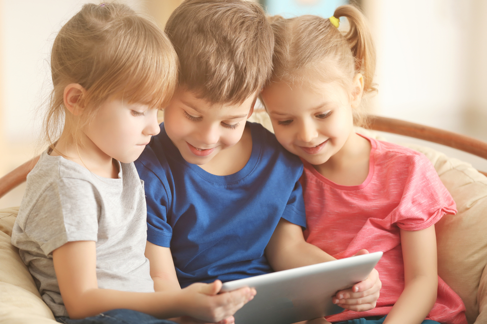 Children using a tablet to enhance reading comprehension skills