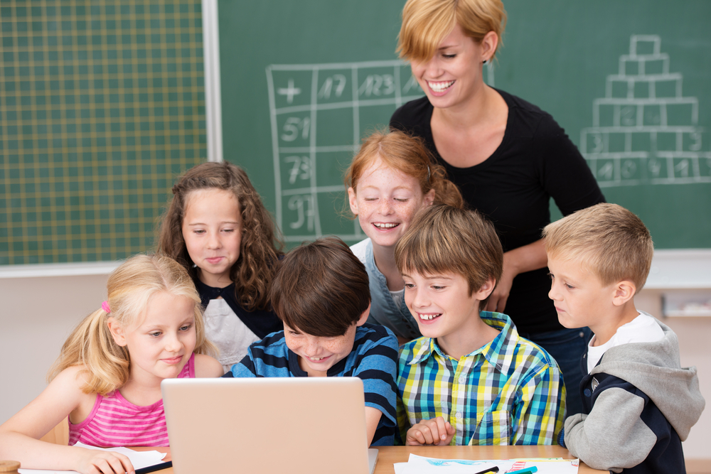 Children learning reading fluency with teacher guidance
