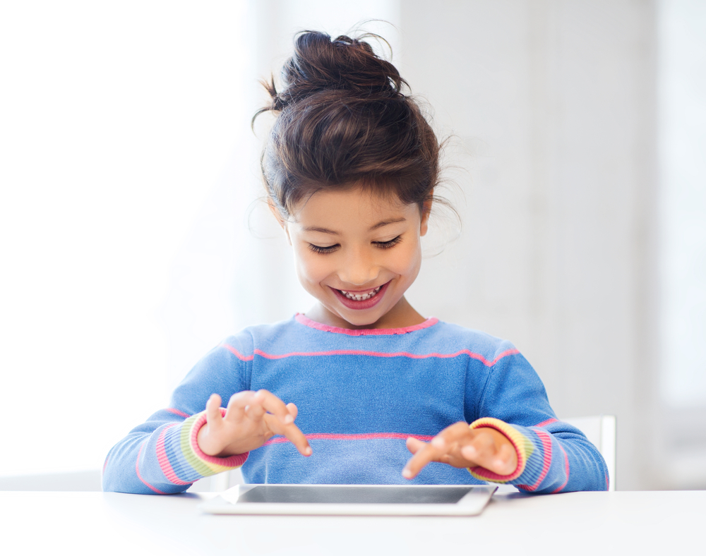 Girl using a tablet to learn reading comprehension